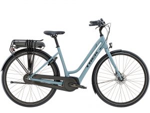 Trek electric bikes have a step-through frame and battery installed on the rear cargo rack.