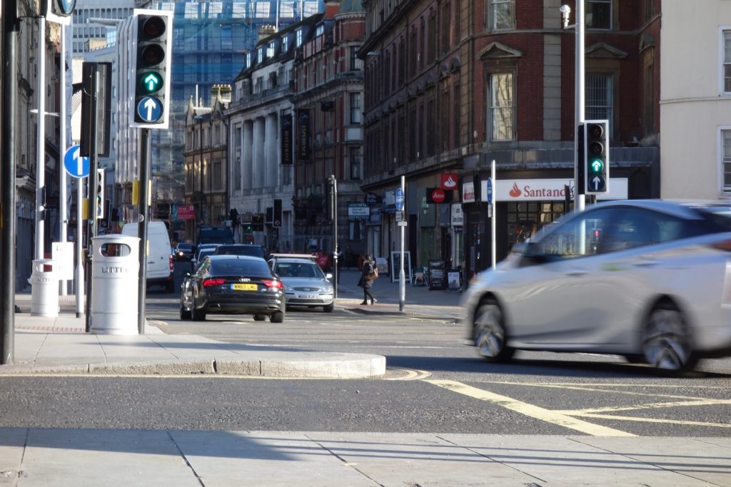 Bristol city centre after metrobus construction work - cars passing green light in the direction of Baldwin street