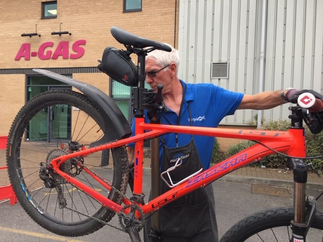 The bike technician will put your bike on a bike stand so they can easily inspect all parts of it.